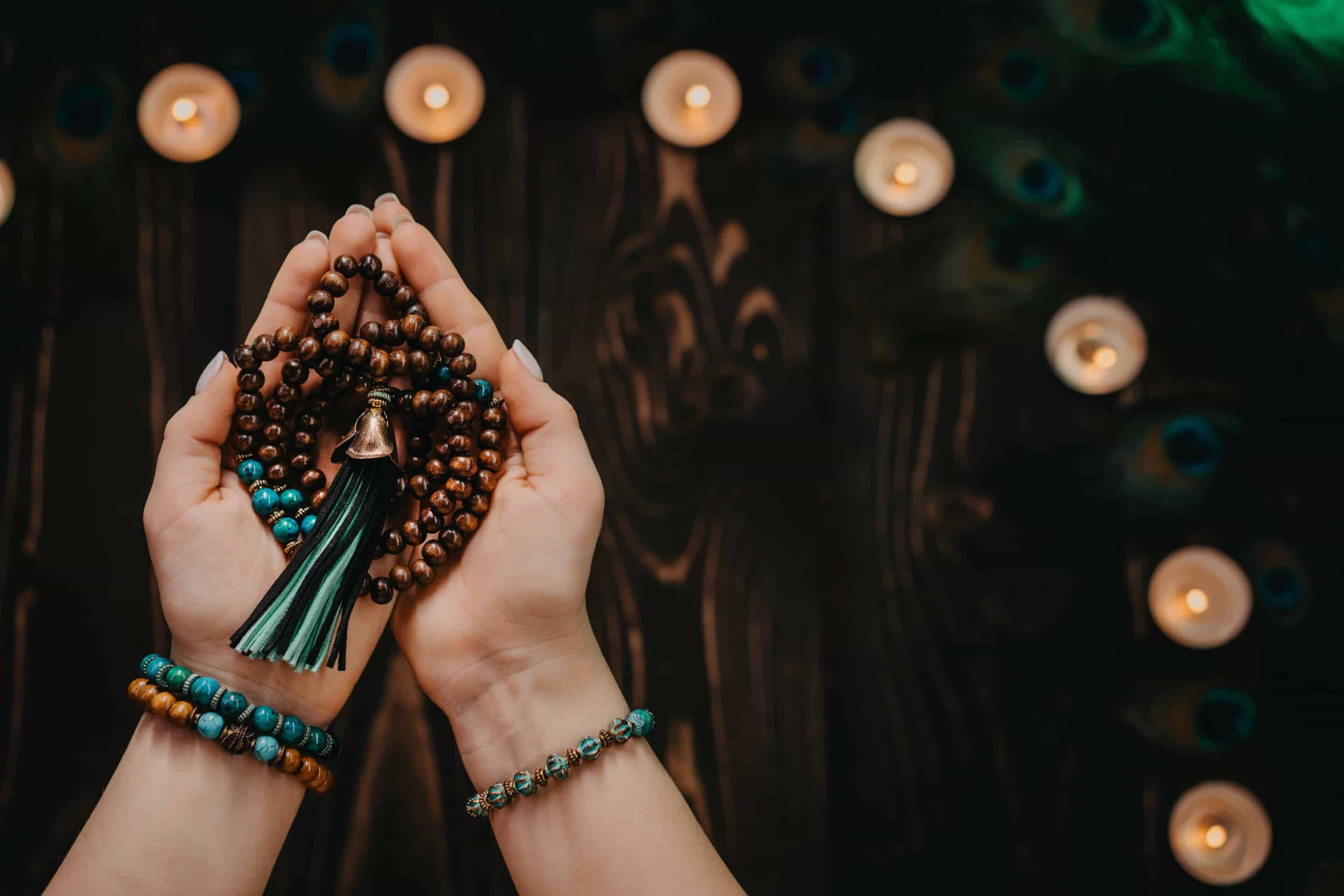 woman-holds-in-hand-wooden-mala-beads-strands-used-2025-03-08-21-05-01-utc-min